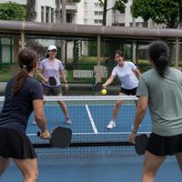 Illustration: women playing pickleball